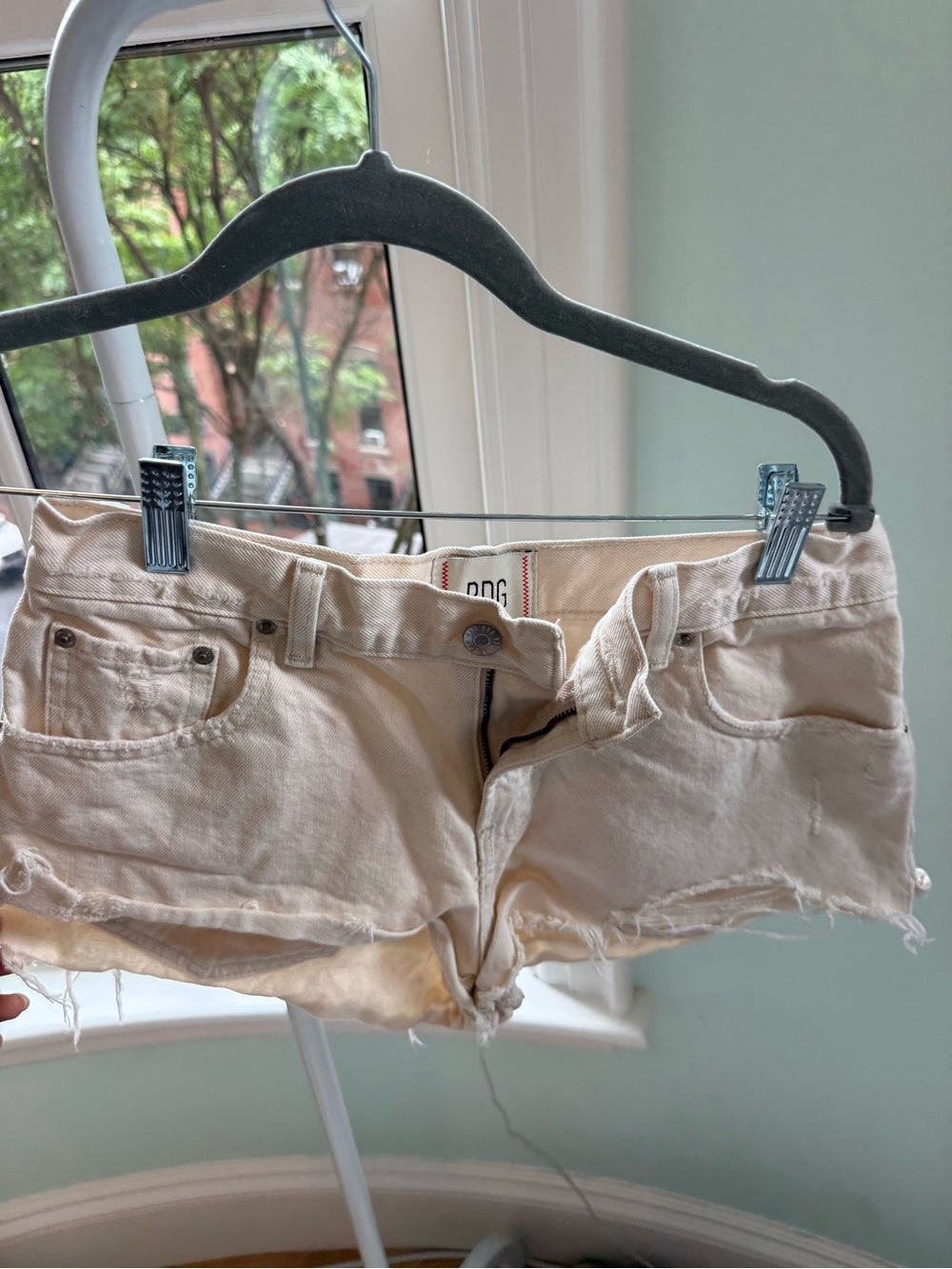 BDG Cream Distressed Low-Rise Denim Shorts